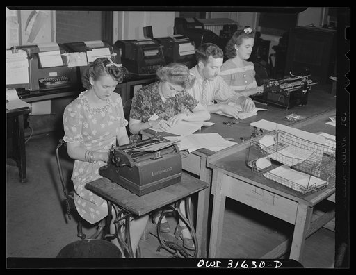 Untitled photo, possibly related to: Washington, D.C. Preparing an advisory forecast at the U.S. Weather Bureau. Weather forecasts and advices are coded for transmission to military and civilian centers for war activity
