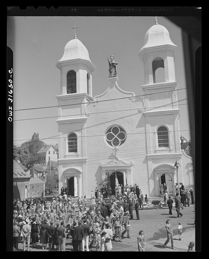 Gloucester, Massachusetts. The Portugeese church of Our Lady of Good Voyage is noted for its carillion of thirty-two bells. Above the doors is a Madonna holding a schooner in one hand while the other is raised in blessing the waters