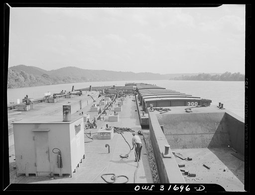 Gallipolis, Ohio. Deck hands straightening out the ropes, seen from the Charles T. Campbell, a towboat