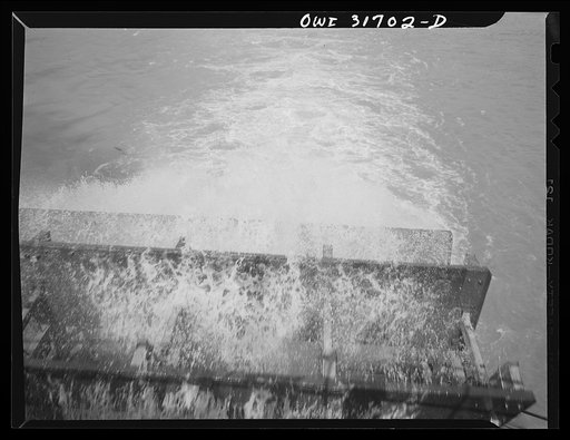 The paddle wheel on a towboat going down the Ohio River