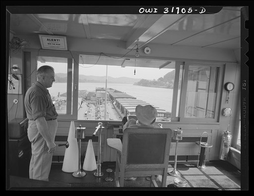 The pilot of the Charles T. Campbell, a tugboat, sitting on the "throne", going down the river