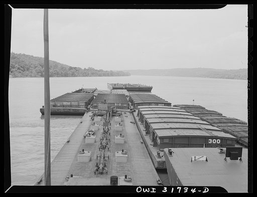 Shifting barges to new positions in the tow of the towboat Ernest T. Weir going down the Ohio River to Cincinnati