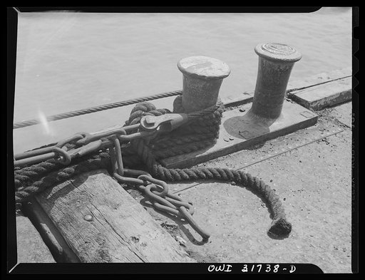 The connecting lines between two barges being towed by the towboat Ernest T. Weir down the Ohio River to Cincinnati