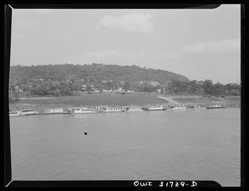 Some small flat-bottom wheeler pleasure boats on the Ohio River as seen from the towboat Ernest T. Weir on its way down to Cincinnati