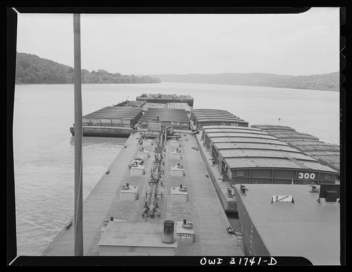 Empty barges, which will be dropped later, are placed in the front of the tow of the towboat Ernest T. Weir going down the Ohio River to Cincinnati