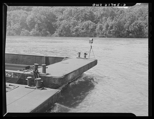 A safety light at the end of a barge being towed by the Ernest T. Weir going down the Ohio River to Cincinnati