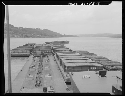 Shifting empty barges in the tow of the towboat Ernest T. Weir going down the Ohio River to Cincinnati