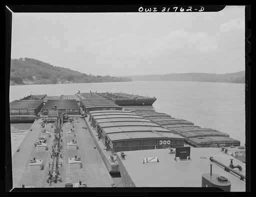 Shifting empty barges in the tow of the towboat Ernest T. Weir going down the Ohio River to Cincinnati