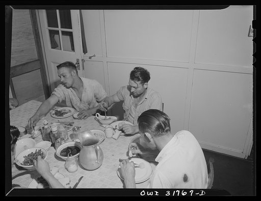The crew eating dinner aboard the towboat Ernest T. Weir going down the Ohio River to Cincinnati