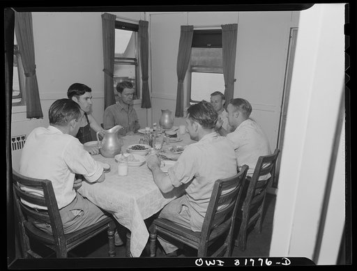The crew of the towboat Ernest T. Weir going down the Ohio River to Cincinnati eating dinner