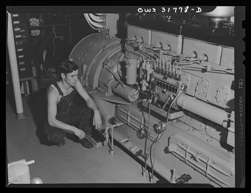 A diesel engine in the engine room of the towboat Ernest T. Weir going down the Ohio River to Cincinnati