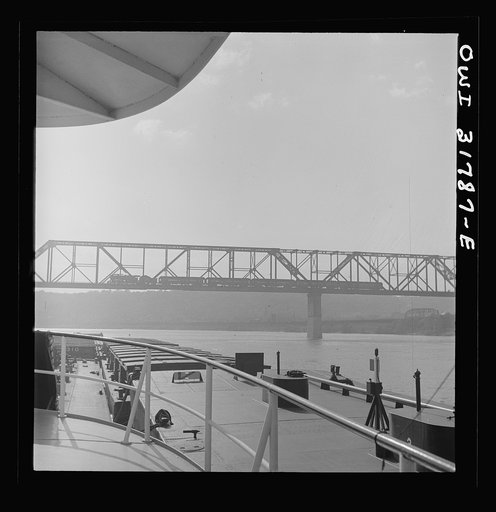 Untitled photo, possibly related to: Cincinnati (vicinity), Ohio. A bridge over the Ohio River, as seen from the towboat Ernest T. Weir