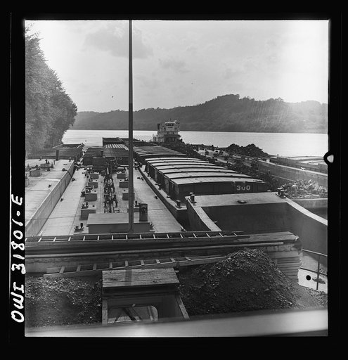 Untitled photo, possibly related to: Barges in the tow of the towboat Ernest T. Weir going down the Ohio River to Cincinnati