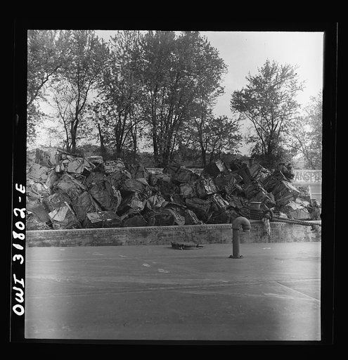 Scrap iron in a barge tied along the Ohio River bank