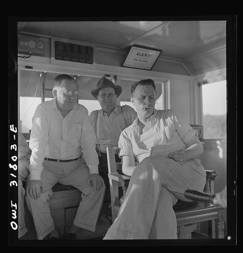The captain and two pilots aboard the towboat Ernest T. Weir going down the Ohio River to Cincinnati