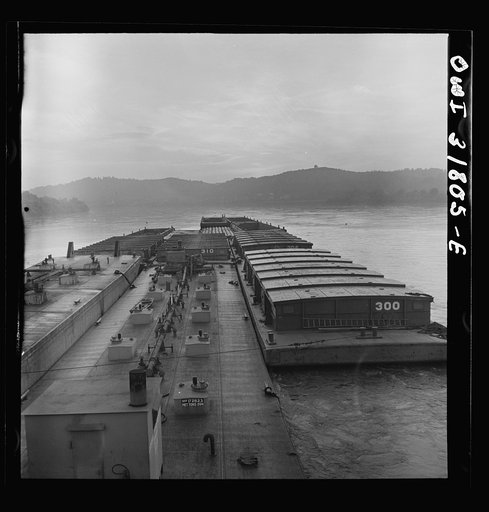Barges in the tow of the towboat Ernest T. Weir going down the Ohio River to Cincinnati
