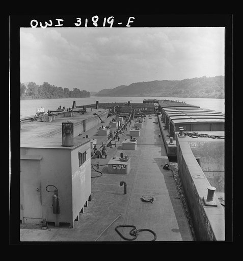 Untitled photo, possibly related to: Barges in the tow of the towboat Ernest T. Weir going down the Ohio River to Cincinnati