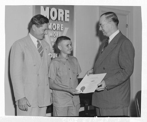 Washington, D.C. Dial Rawl, represented with a certificate from the U.S. War Production Board for his outstanding services in the scrap salvage wartime campaign