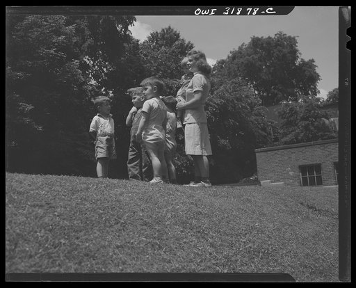 New Britain, Connecticut. A child care center opened September 15, 1942, for thirty children, age two to five, of mothers engaged in war industry. The hours are 6:30 a.m. to 6 p.m., six days per week. Miss Jane Machmer and some of the cildren whose mothers are welders, press operators, stenographers