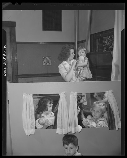 New Britain, Connecticut. A child care center, opened September 15, 1942, for thirty children, age two to five, of mothers engaged in war industry. The hours are 6:30 a.m. to 6 p.m. six days per week. For daily indoor play the children have dolls, blocks and climbing apparatus; they do clay work, pa