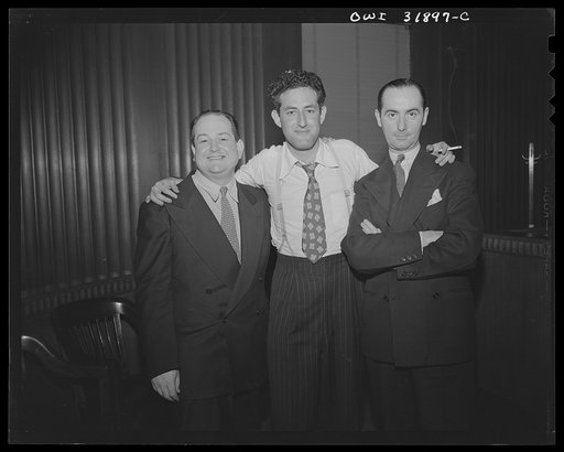 Three characters in the film "Black Marketing," a motion picture produced by the U.S. Office of War Information (OWI) and released August 19, 1943
