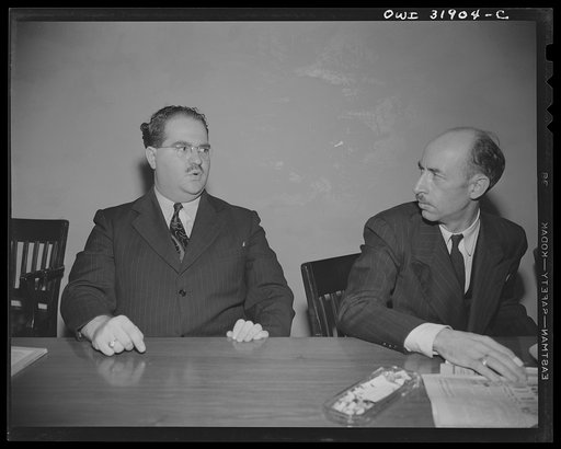 Two characters, in an angry mood, photographed during a scene in "Black Marketing," a motion picture produced by the U.S. Office of War Information (OWI), and released August 19, 1943
