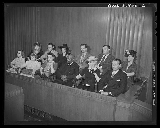 The jury in a courtroom scene during the filming of "Black Marketing," a motion picture produced by the U.S. Office of War Information (OWI) and released August 19, 1943