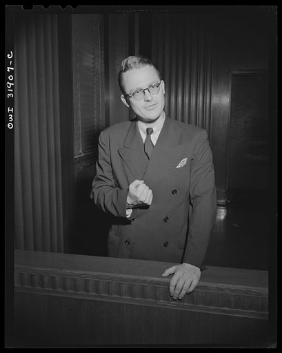 A courtroom scene during the filming of "Black Marketing," a motion picture produced by the U.S. Office of War Information (OWI) and released August 19, 1943