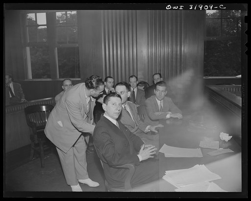 A courtroom scene during the filming of "Black Marketing," a motion picture produced by the U.S. Office of War Information (OWI) and released August 19, 1943