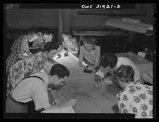 Untitled photo, possibly related to: Washington, D.C. Workers of the U.S. Geological Survey, Alaska branch, making the final drafting of an air navigation chart for the U.S. Army air forces