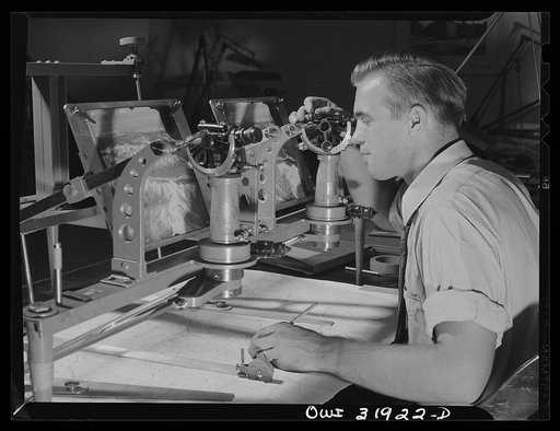 Washington, D.C. John Zydik, an employee of the U.S. Geological Survey, Alaska branch, using the double-photo-alidade to make a topographic map