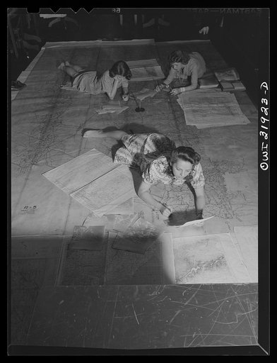 Untitled photo, possibly related to: Washington, D.C. Miss Barbara Austin, Mrs. Mary Keddy, and Miss Martha Hallman, three employees of the U.S. Geological Survey, Alaska branch, making a final checking of the base manuscript, in connection with air navigation charts