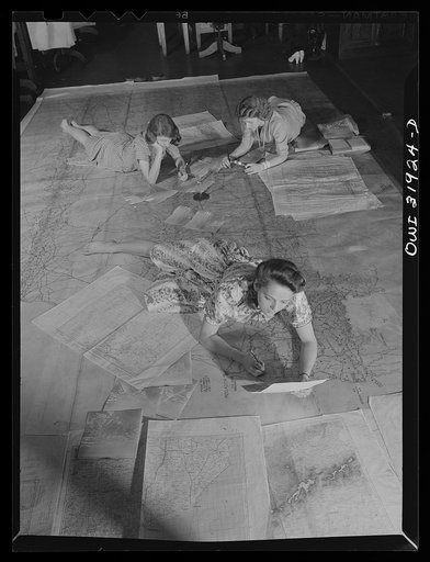 Washington, D.C. Miss Barbara Austin, Mrs. Mary Keddy, and Miss Martha Hallman, three employees of the U.S. Geological Survey, Alaska branch, making a final checking of the base manuscript, in connection with air navigation charts