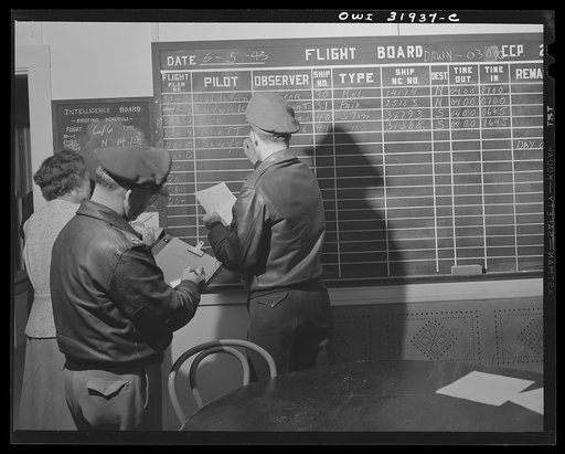 Untitled photo, possibly related to: Bar Harbor, Maine. Civil Air Patrol base headquarters of coastal patrol no. 20. Dawn patrol flyers and observers making routine reports before starting on patrol