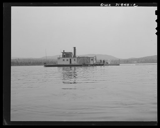 Spring pulpwood drive on the Brown Company timber holdings in Maine. Side-wheel steamer which tows pulp wood twelve miles down Mooselookmeguntic Lake