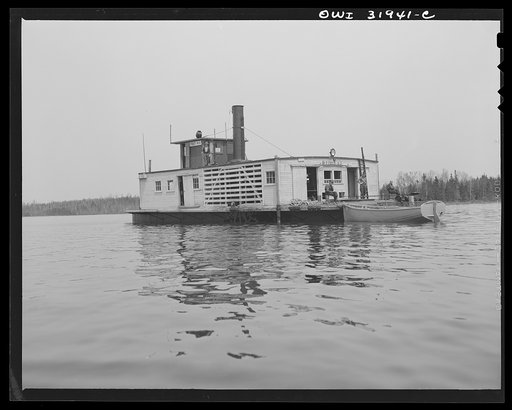 Spring pulpwood drive on the Brown Company timber holdings in Maine. Side-wheel steamer which tows pulp wood twelve miles down Mooselookmeguntic Lake. These lake steamers have two crews, each of which works two six-hour shifts daily