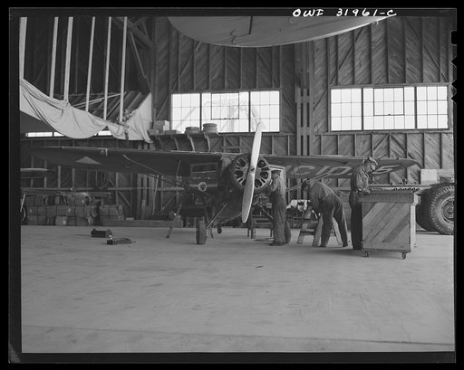Bar Harbor, Maine. Civil Air Patrol base headquarters of coastal patrol no. 20. Ground crew making routine overhaul of a patrol plane