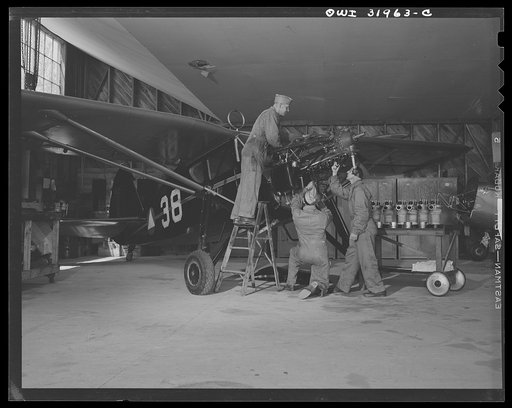 Bar Harbor, Maine. Ground crew making routine overhaul of a patrol plane
