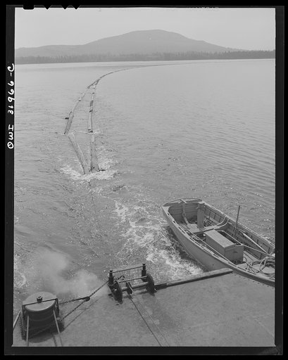 Spring pulpwood drive on the Brown Company timber holdings in Maine. On its return trip up Mooselookmeguntic Lake, the steamer tows an empty boom to be refilled with the next day's load