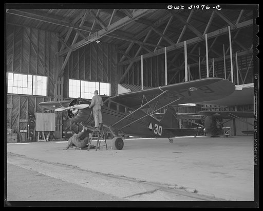 Bar Harbor, Maine. Ground crew making routine overhaul of a patrol plane