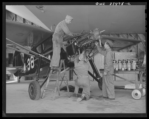 Bar Harbor, Maine. Ground crew making routine overhaul of a patrol plane
