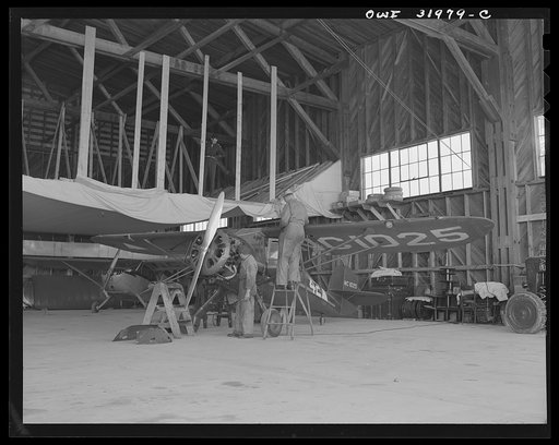 Bar Harbor, Maine. Ground crew making routine overhaul of a patrol plane