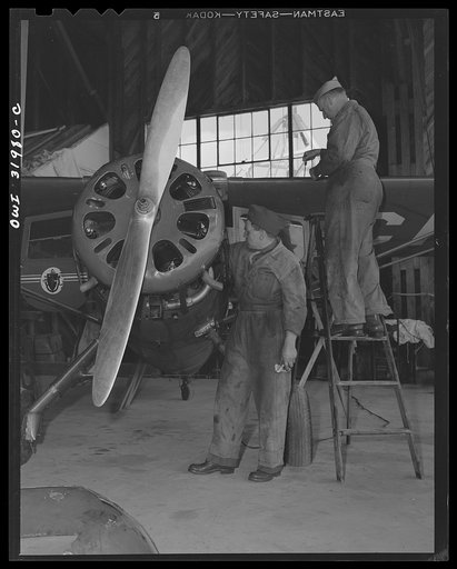 Bar Harbor, Maine. Civil Air Patrol base headquarters of coastal patrol no. 20. Ground crew making routines overhaul of a patrol plane