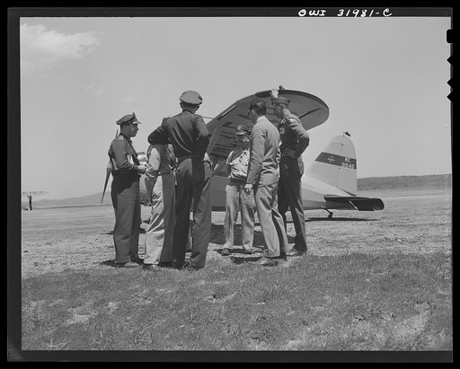 Bar Harbor, Maine. Civil Air Patrol base headquarters of coastal patrol no. 20. Pilots and observers talking things over