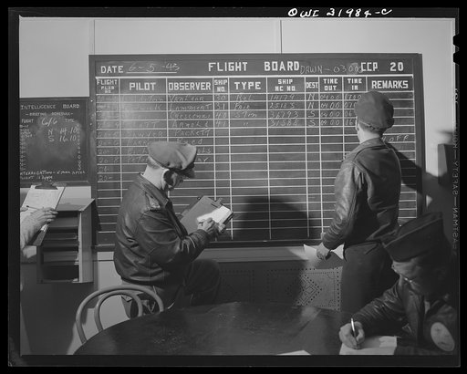 Untitled photo, possibly related to: Bar Harbor, Maine. Civil Air Patrol base headquarters of coastal patrol no. 20. Dawn patrol flyers and observers making routine reports before starting on patrol