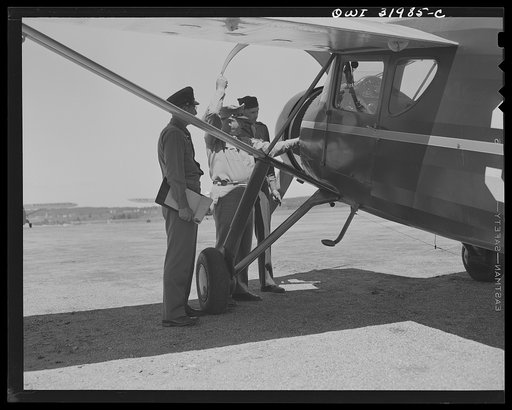 Bar Harbor, Maine. Civil Air Patrol base headquarters of coastal patrol no. 20. Major James B. King, base commander, making weekly inspection