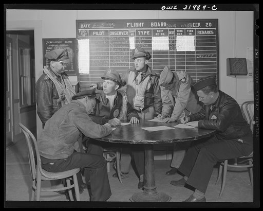 Untitled photo, possibly related to: Bar Harbor, Maine. Civil Air Patrol base headquarters of coastal patrol no. 20. Dawn patrol flyers and observers making routine reports before starting on patrol