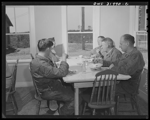 Untitled photo, possibly related to: Bar Harbor, Maine. Civil Air Patrol base headquarters of coastal patrol no. 20. Members of the ground crew at lunch in the base canteen