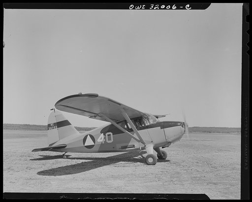 Bar Harbor, Maine. Civil Air Patrol base headquarters of coastal patrol no. 20. Patrol plane ready to take off for dusk patrol