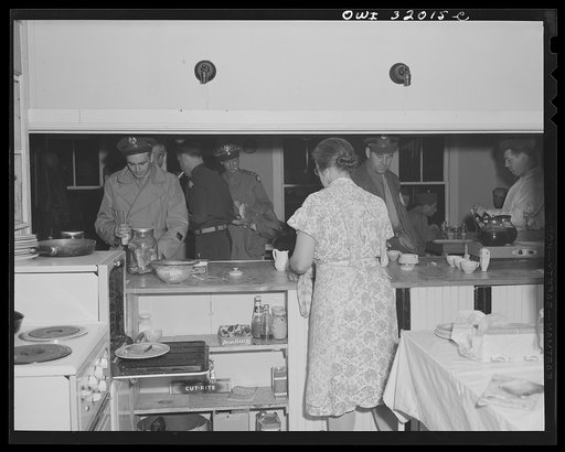 Bar Harbor, Maine. Civil Air Patrol base headquarters of coastal patrol no. 20. Dawn patrol warming up in the canteen at 3 a.m.